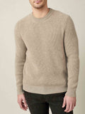 Model wears the Luca Faloni Chunky Knit Crew Neck in Camel Beige, a four-ply cashmere jumper with a ribbed, relaxed fit.