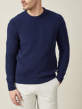 Front view of a model wearing Luca Faloni's midnight blue chunky knit cashmere crew neck.