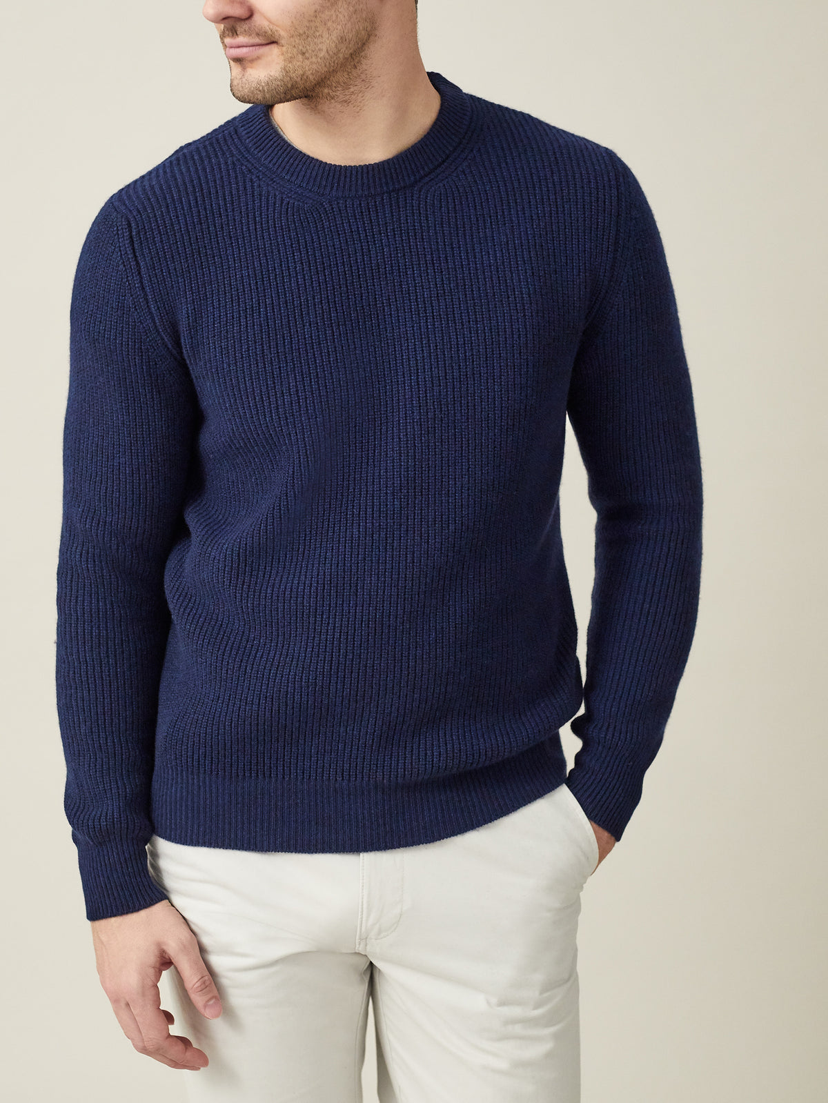 Front view of a model wearing Luca Faloni's midnight blue chunky knit cashmere crew neck.