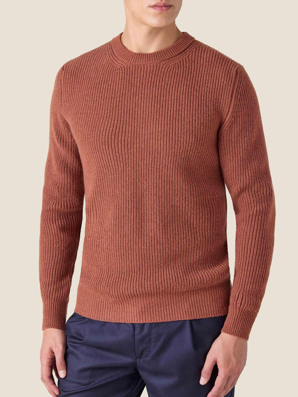 Front view of a model wearing the rust Chunky Knit Crew Neck sweater in pure cashmere by Luca Faloni.