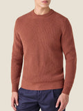 Front view of a model wearing the rust Chunky Knit Crew Neck sweater in pure cashmere by Luca Faloni.