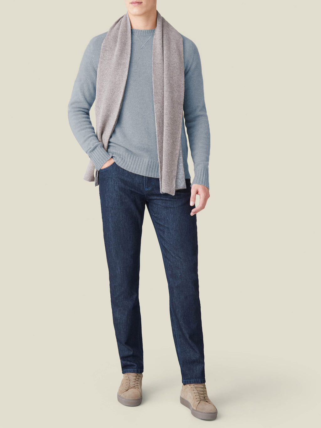 Model wears the French Blue Cashmere Country Crew Neck, styled with a grey scarf, dark jeans, and beige sneakers.