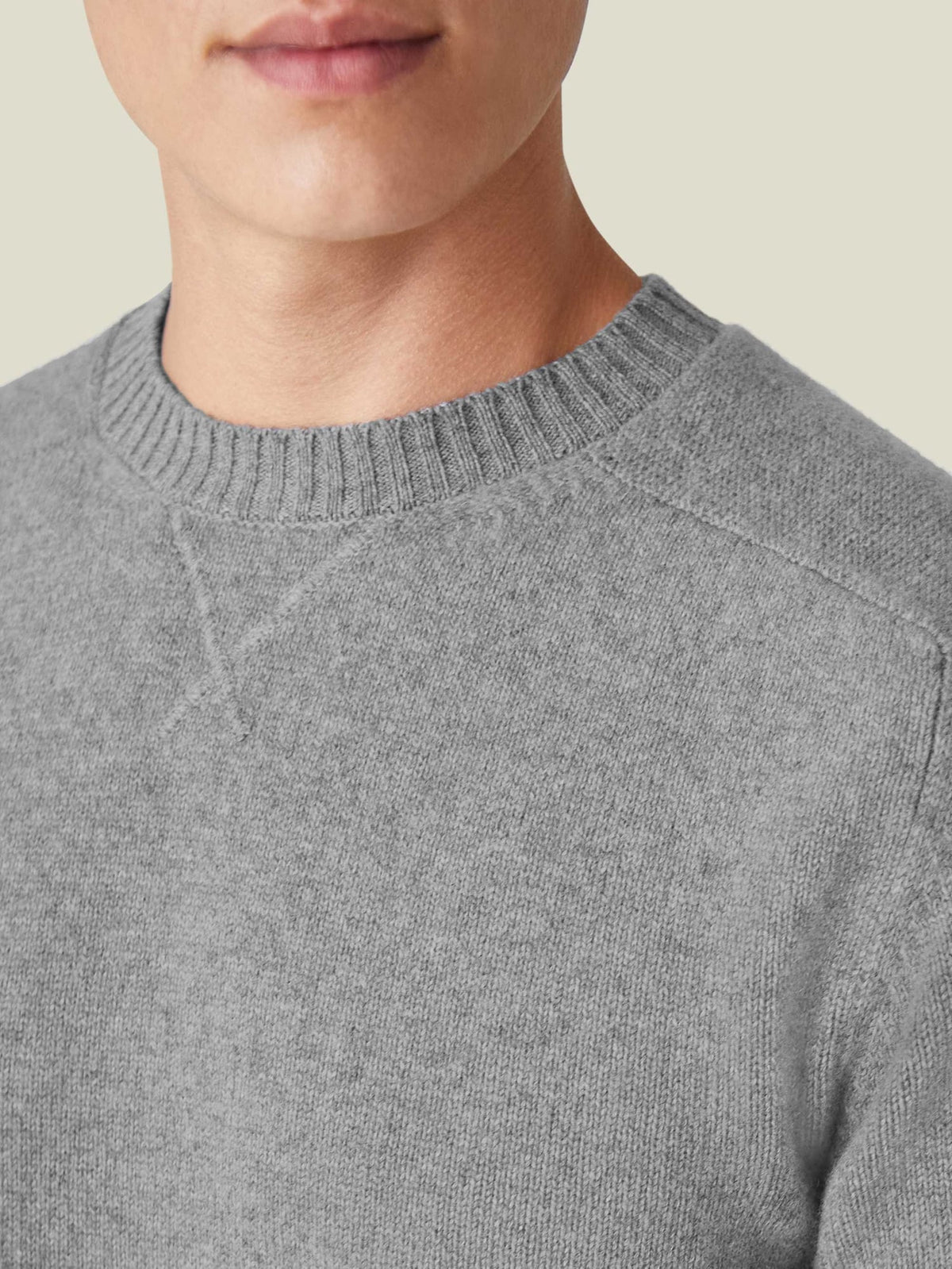 A close-up of the Dolomiti Grey Cashmere Country Crew Neck, showcasing the detailed heritage cross-stitch collar.
