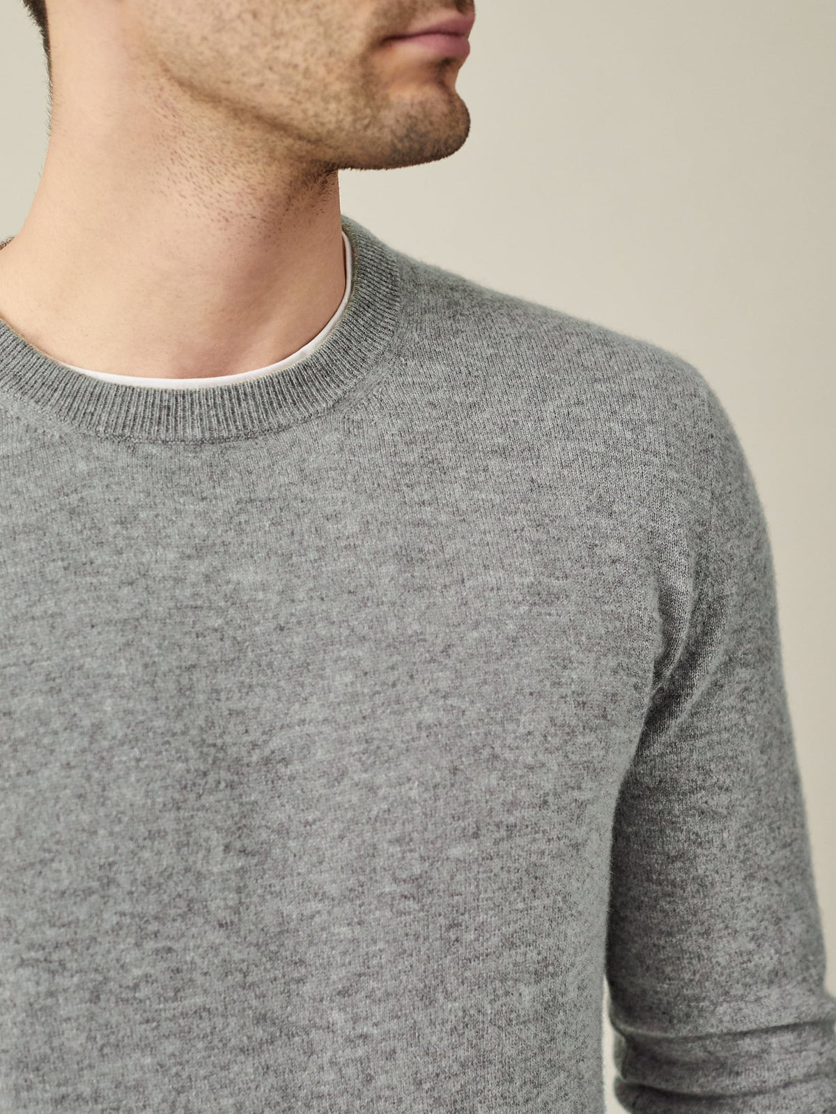 Detailed shot of the Dolomiti Grey Melange Pure Cashmere Crew Neck, showcasing the ribbed collar and fine knit.