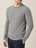 Model wears the Luca Faloni Pure Cashmere Crew Neck in Dolomiti Grey, paired with dark trousers.