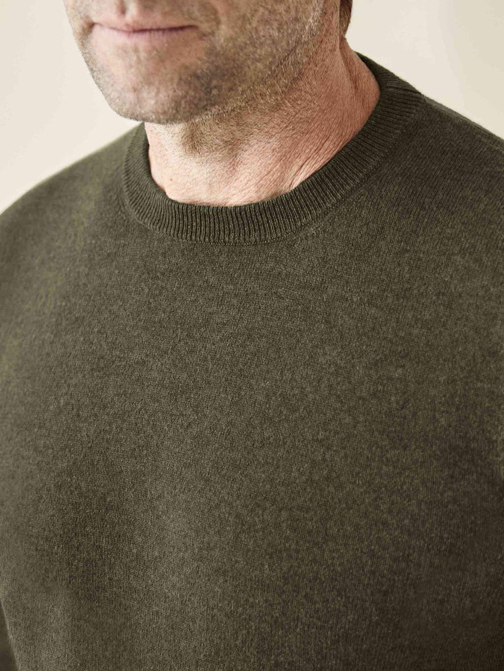 Close-up of the Luca Faloni Cashmere Crew Neck in Hunting Green, showing its ribbed neckline and soft texture.