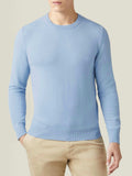 Model wearing the Luca Faloni Sky Blue Cashmere Crew Neck with beige chinos.