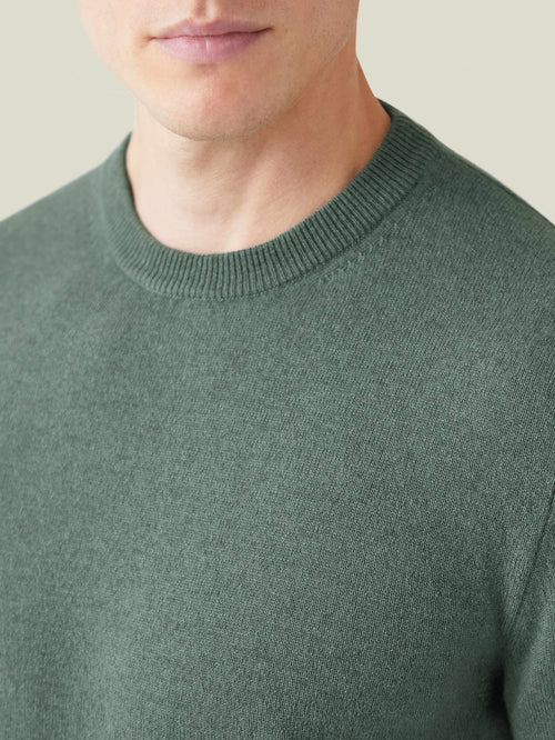 Close-up of the ribbed neckline and soft texture of the Marine Green Cashmere Crew Neck sweater.