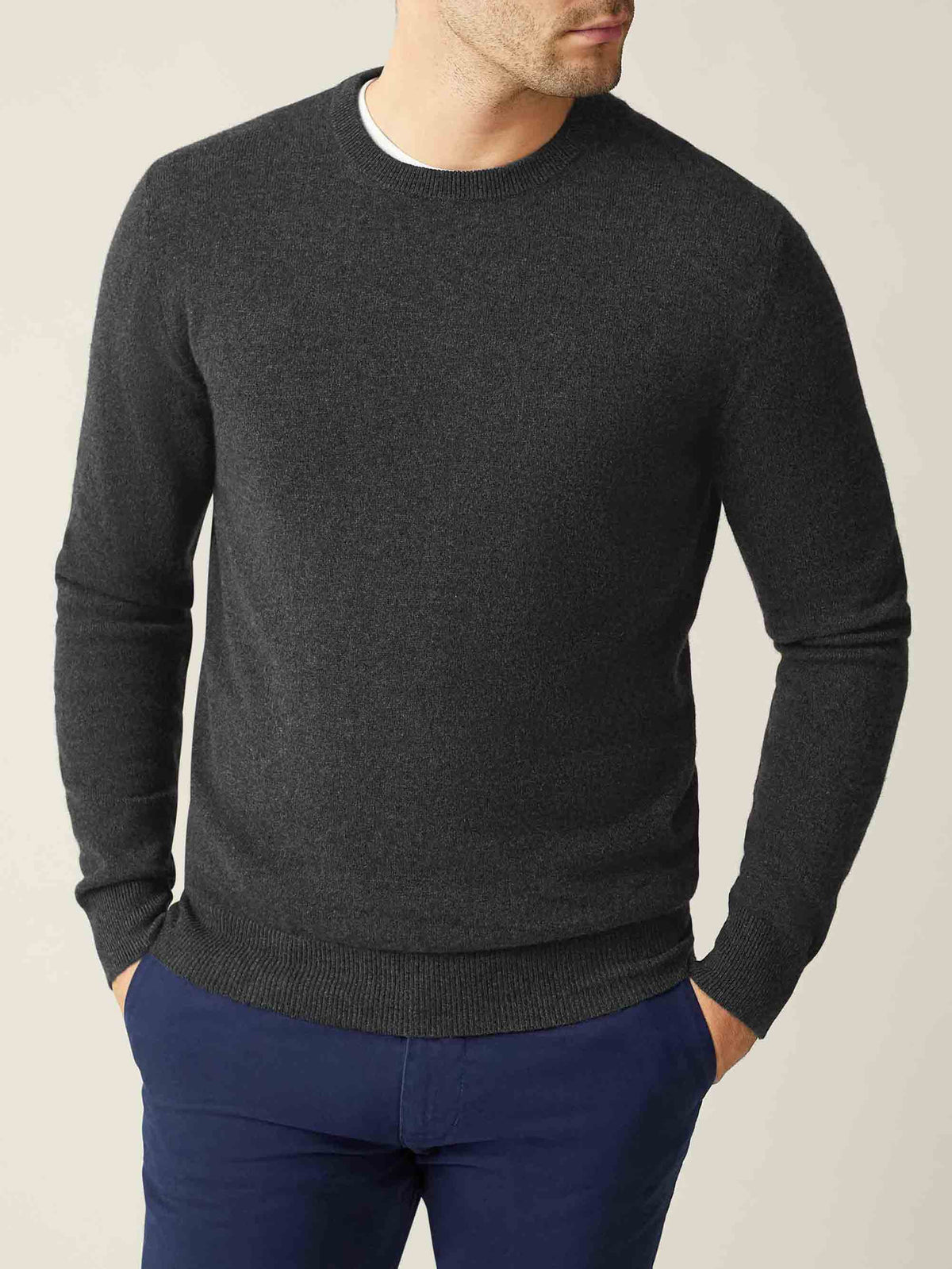 A model wears the Luca Faloni Cashmere Crew Neck in Charcoal Grey, shown from the front.