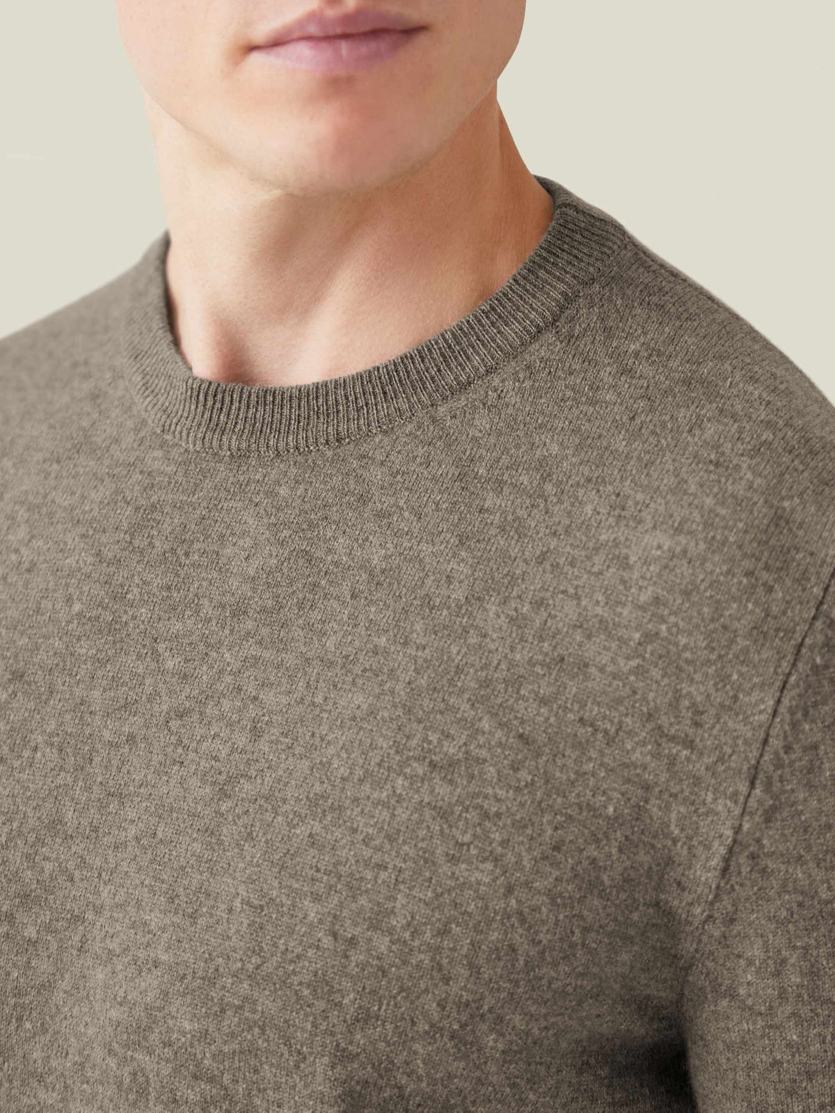 Close-up of the ribbed neckline and soft texture of the Cashmere Crew Neck in Nocciola Brown.