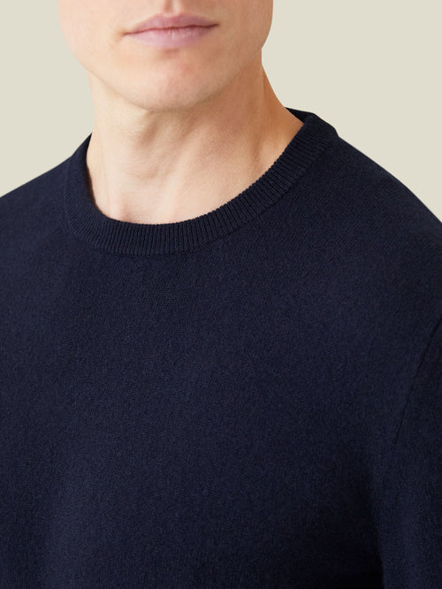 Close-up of the midnight blue Cashmere Crew Neck, showcasing the ribbed neckline and fine two-ply cashmere knit.