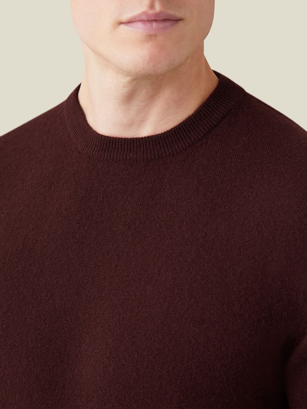Close-up of the Luca Faloni Cashmere Crew Neck in Lava Red, highlighting the ribbed neckline and soft knit texture.