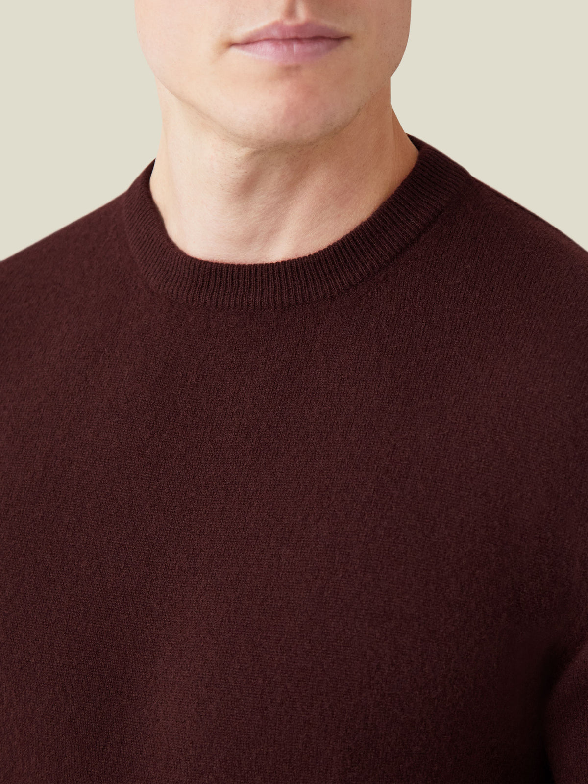 Close-up of the Luca Faloni Cashmere Crew Neck in Lava Red, highlighting the ribbed neckline and soft knit texture.