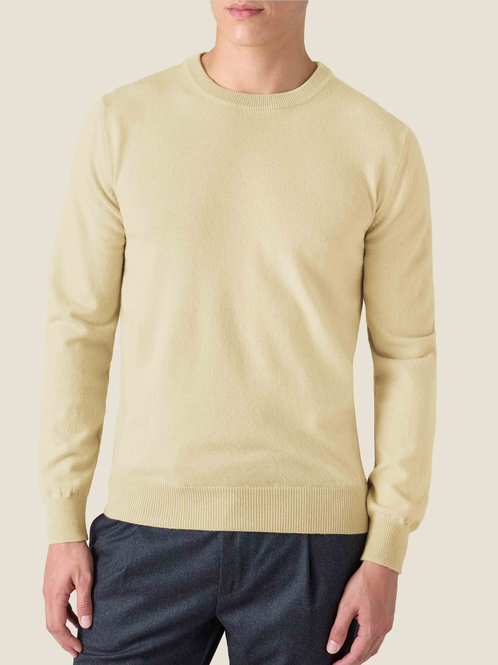 Model wears the Luca Faloni Cashmere Crew Neck in Yellow. Front view against a studio background.
