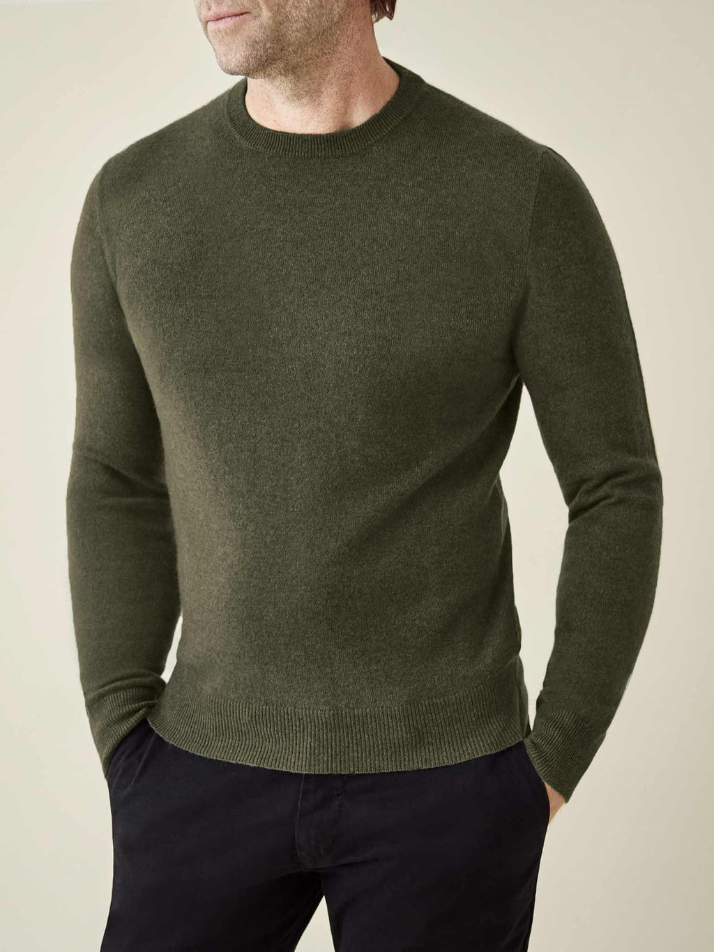 Model wears the Luca Faloni two-ply Cashmere Crew Neck in Hunting Green.