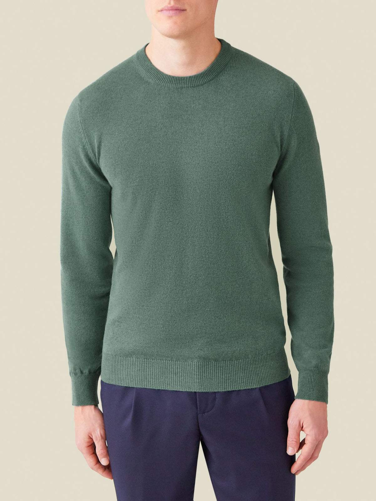 Front view of a model wearing the Luca Faloni marine green cashmere crew neck sweater.