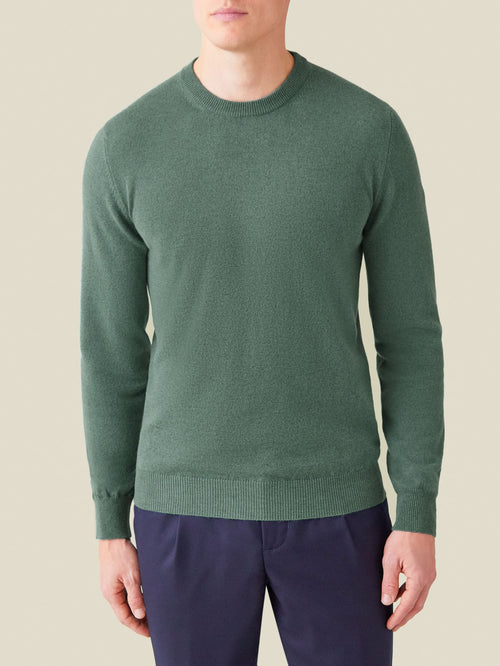 Front view of a model wearing the Luca Faloni marine green cashmere crew neck sweater.