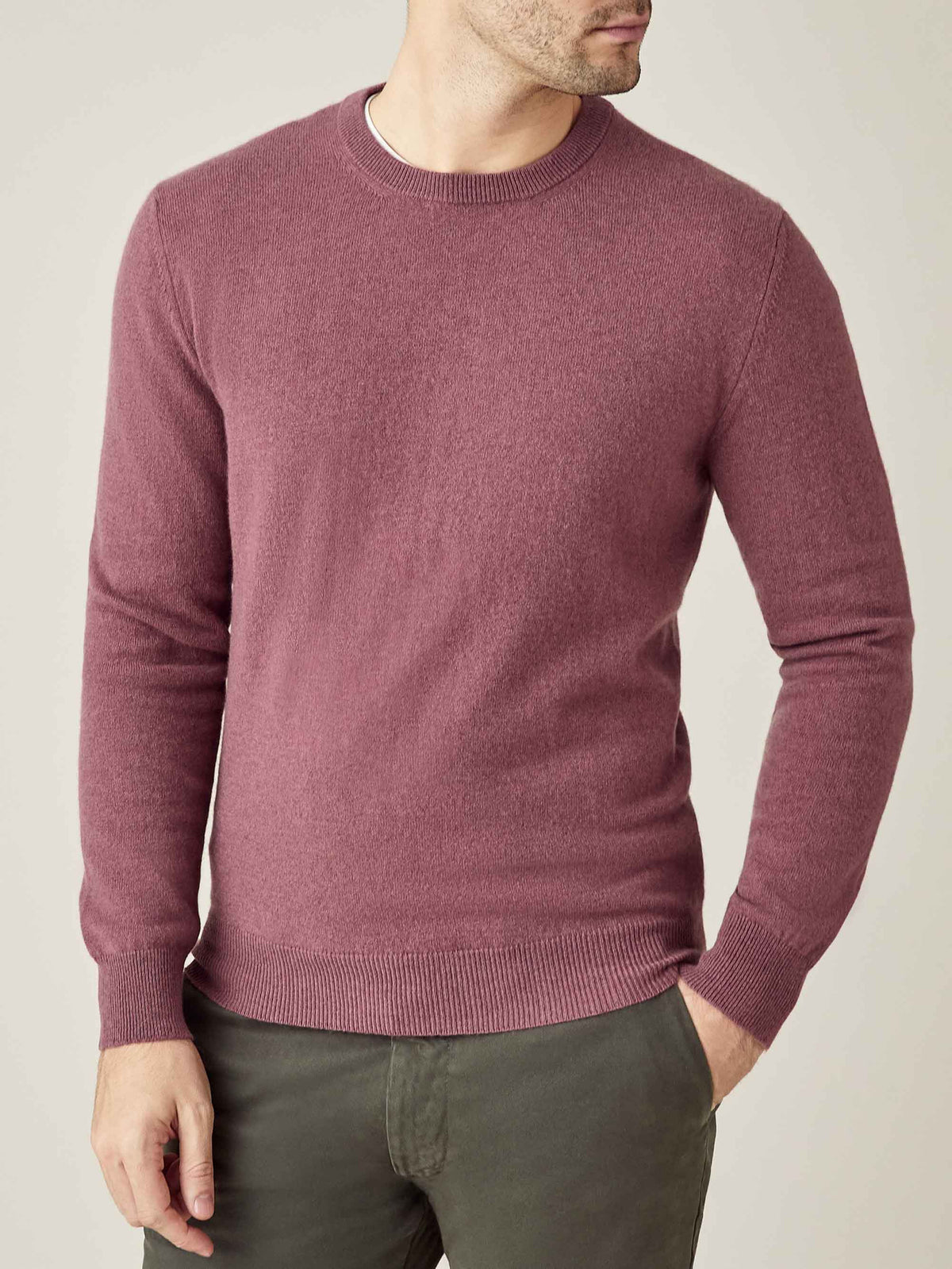 Front view of a model wearing the Luca Faloni Cashmere Crew Neck sweater in Desert Rose.