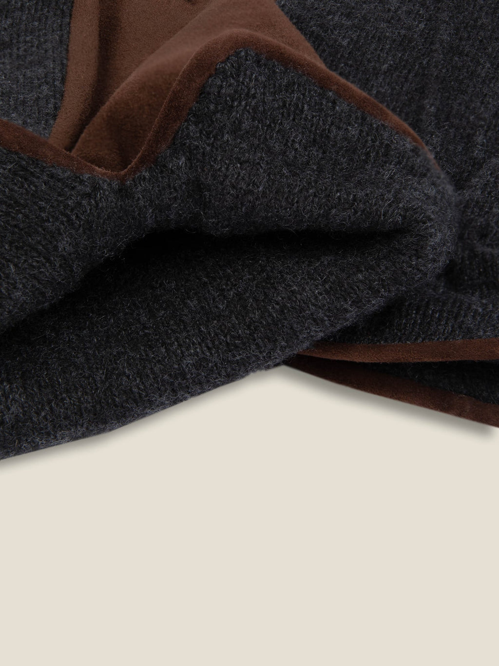 A close-up of the Brown and Charcoal Grey Cashmere and Suede Gloves, showcasing the soft texture of the materials.