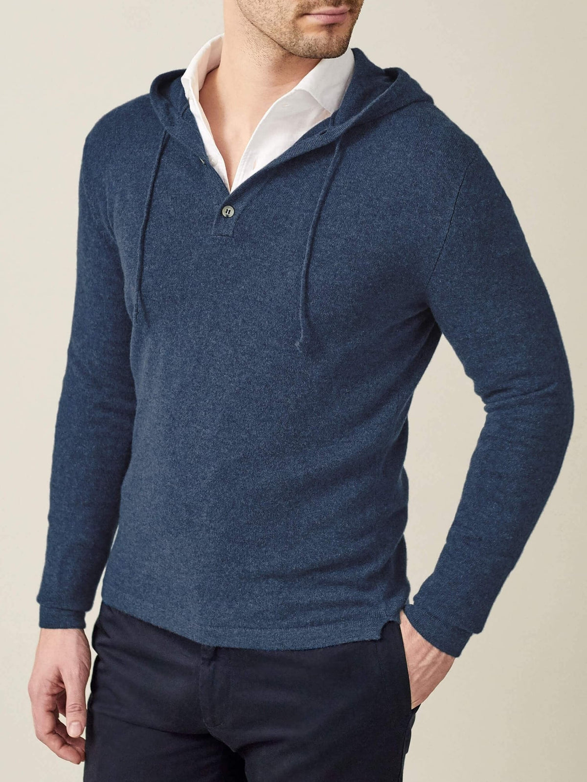 Front view of a model wearing the Atlantic Blue Cashmere Hoodie over a white collared shirt and dark trousers.