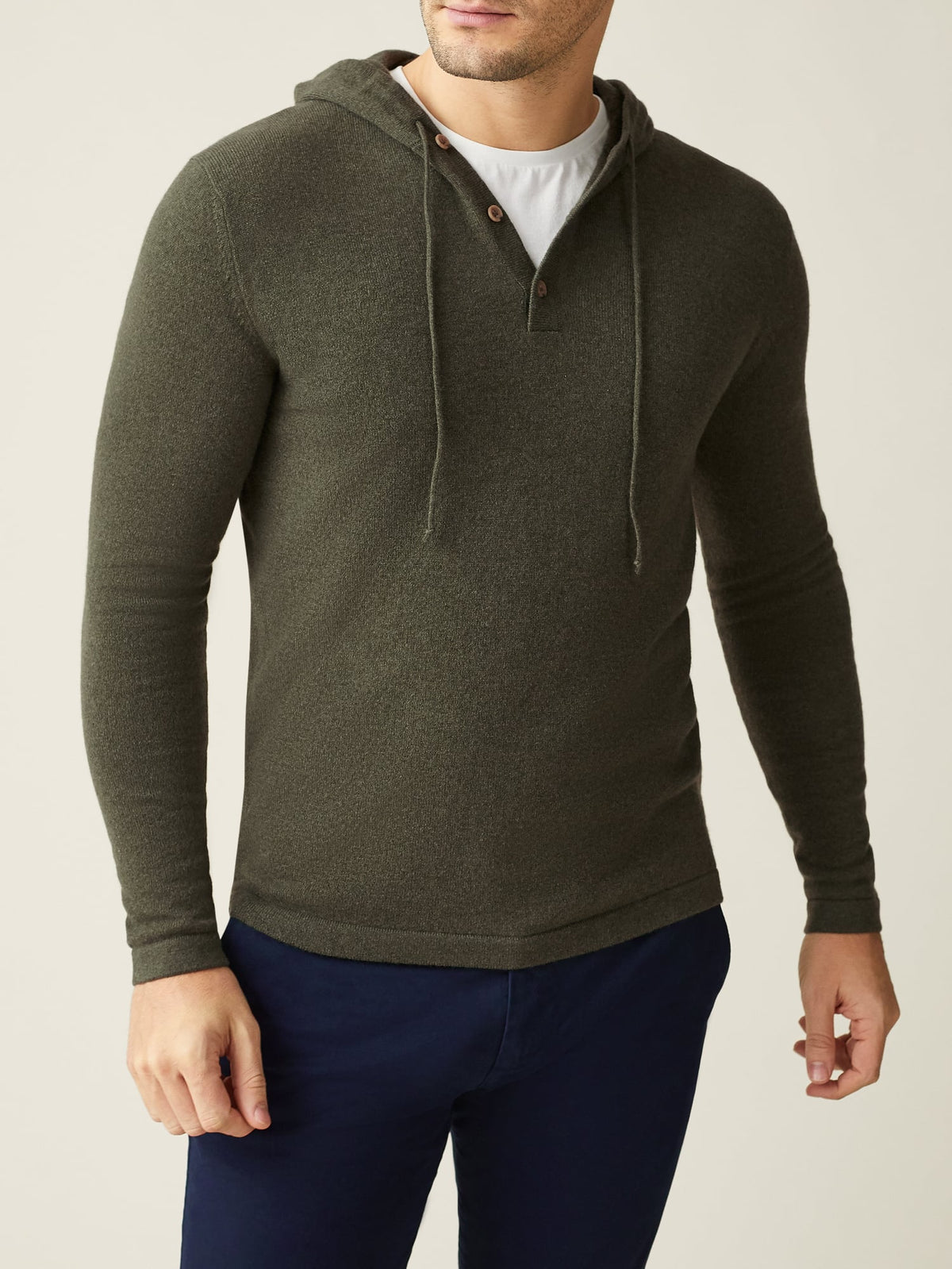 Front view of a man wearing the Luca Faloni Hunting Green Cashmere Hoodie with a white t-shirt and dark blue trousers.