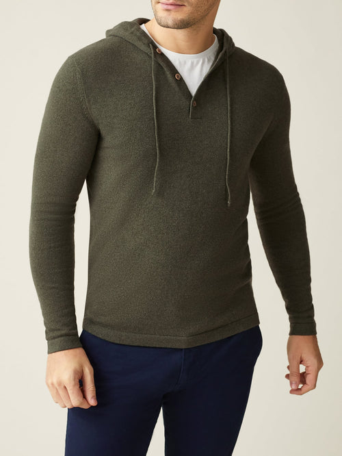 Front view of a man wearing the Luca Faloni Hunting Green Cashmere Hoodie with a white t-shirt and dark blue trousers.