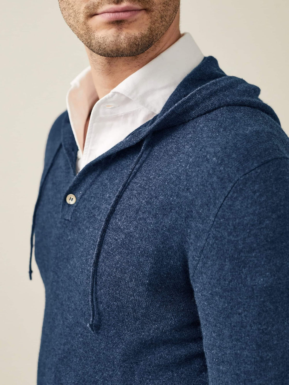 Close-up of the Luca Faloni Atlantic Blue Cashmere Hoodie on a model, highlighting the soft texture and button placket.