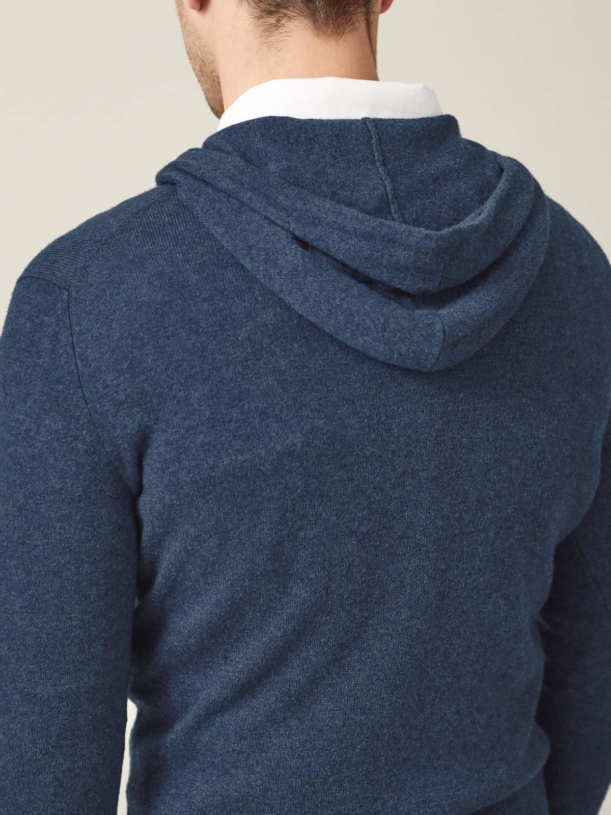 Close-up back view of the Atlantic Blue Cashmere Hoodie, highlighting the hood and soft 2-ply knit texture.