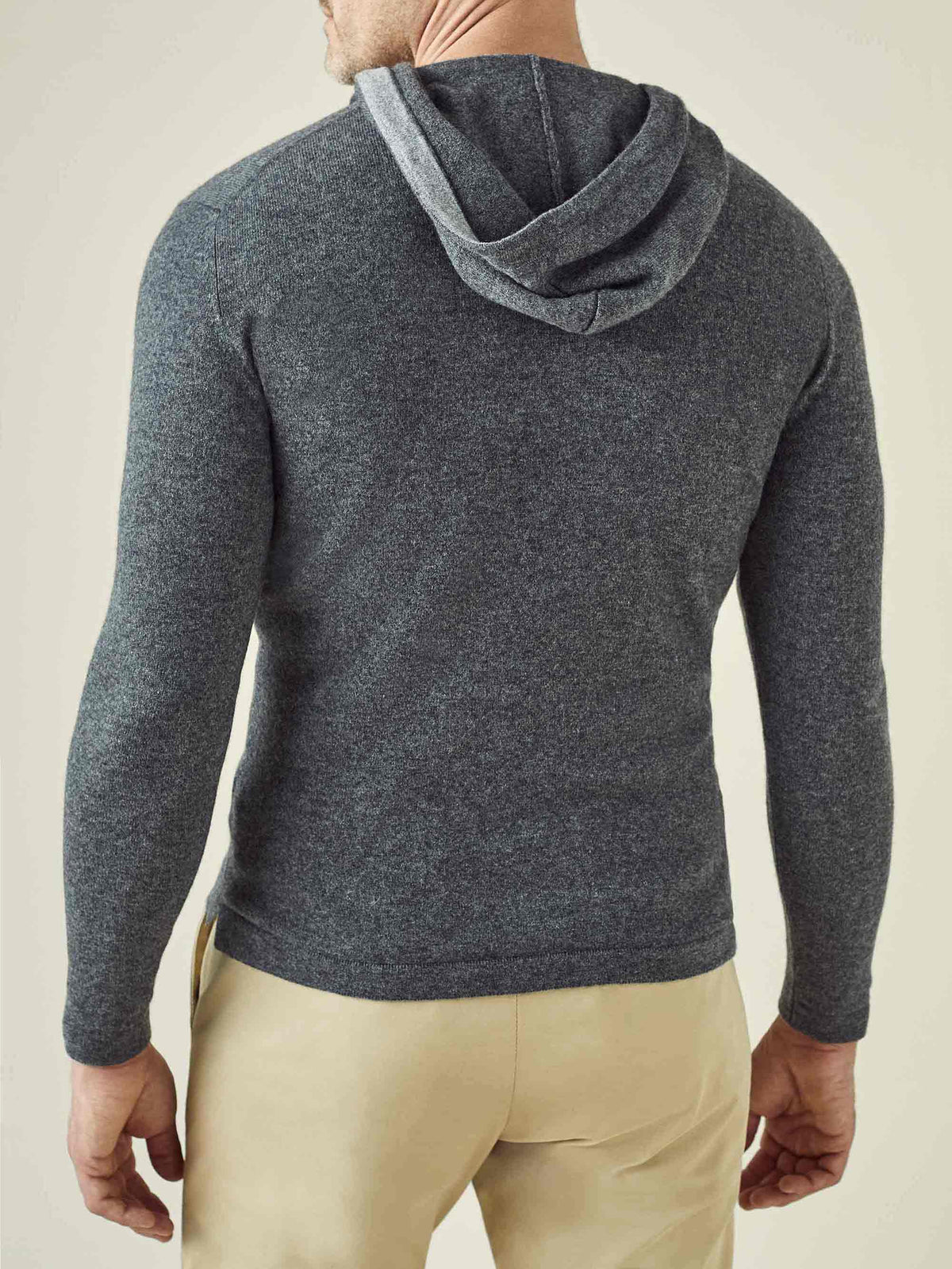 Back view of the Luca Faloni stone grey cashmere hoodie showing the relaxed fit and hood.