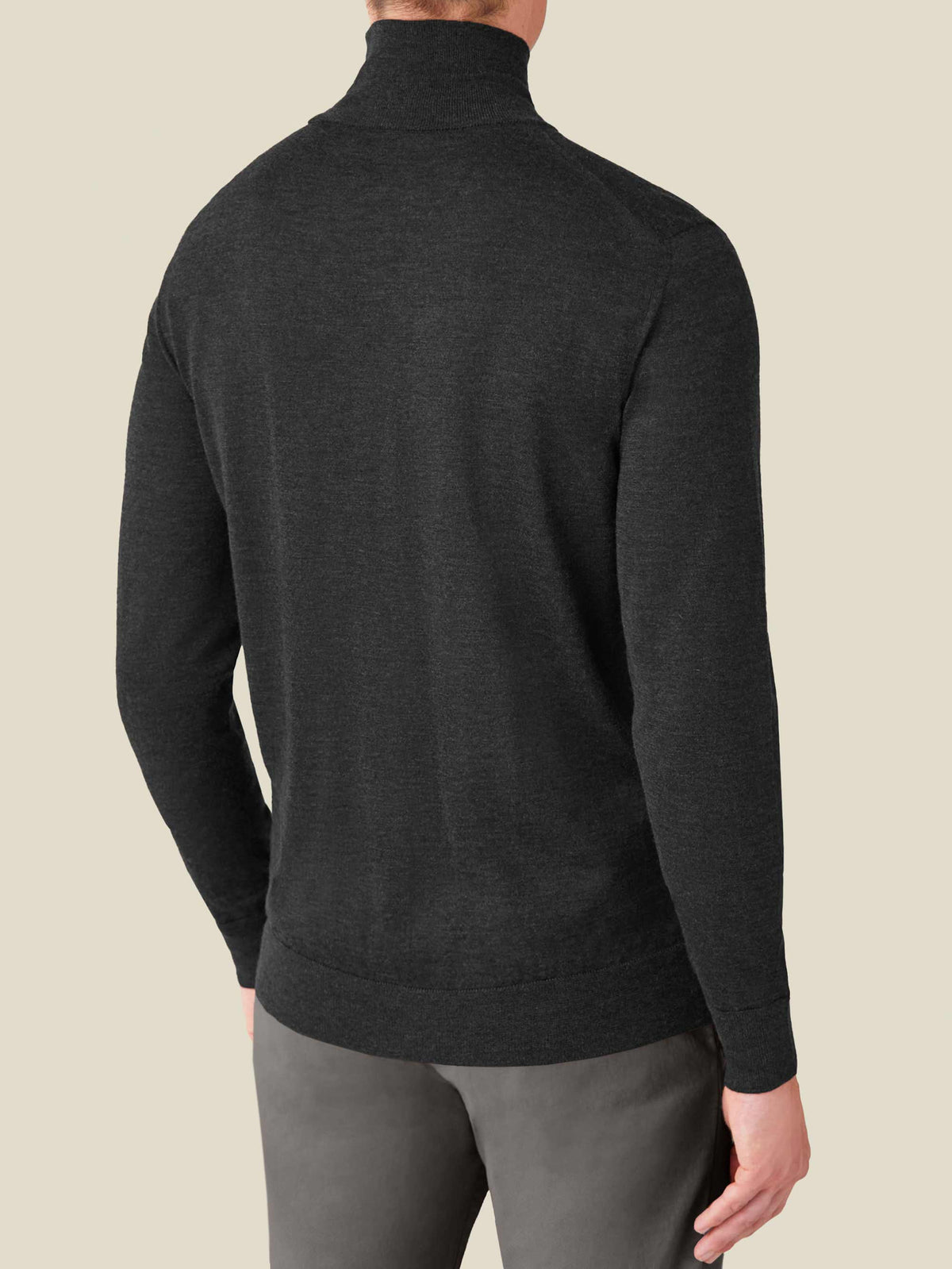 Back view of a man wearing the Luca Faloni Charcoal Grey Silk-Cashmere Mock Neck, showing the fit and ribbed detailing.