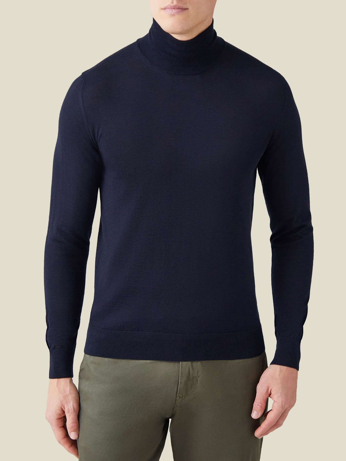 A model wears the Luca Faloni Silk-Cashmere Mock Neck in Navy Blue, showcasing its classic fit and high neckline.