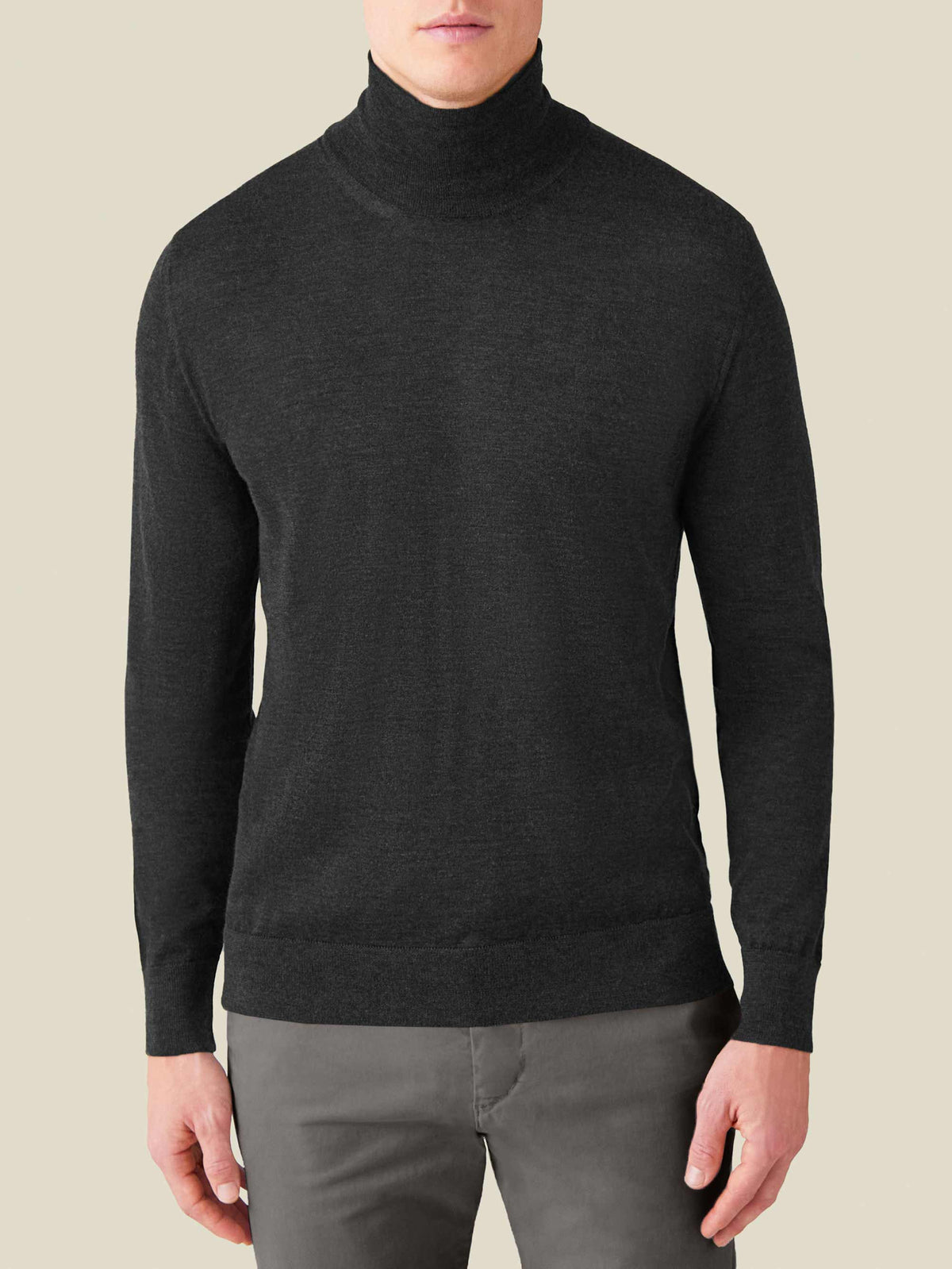 Studio front view of a model wearing the Luca Faloni Silk-Cashmere Mock Neck in Charcoal Grey.