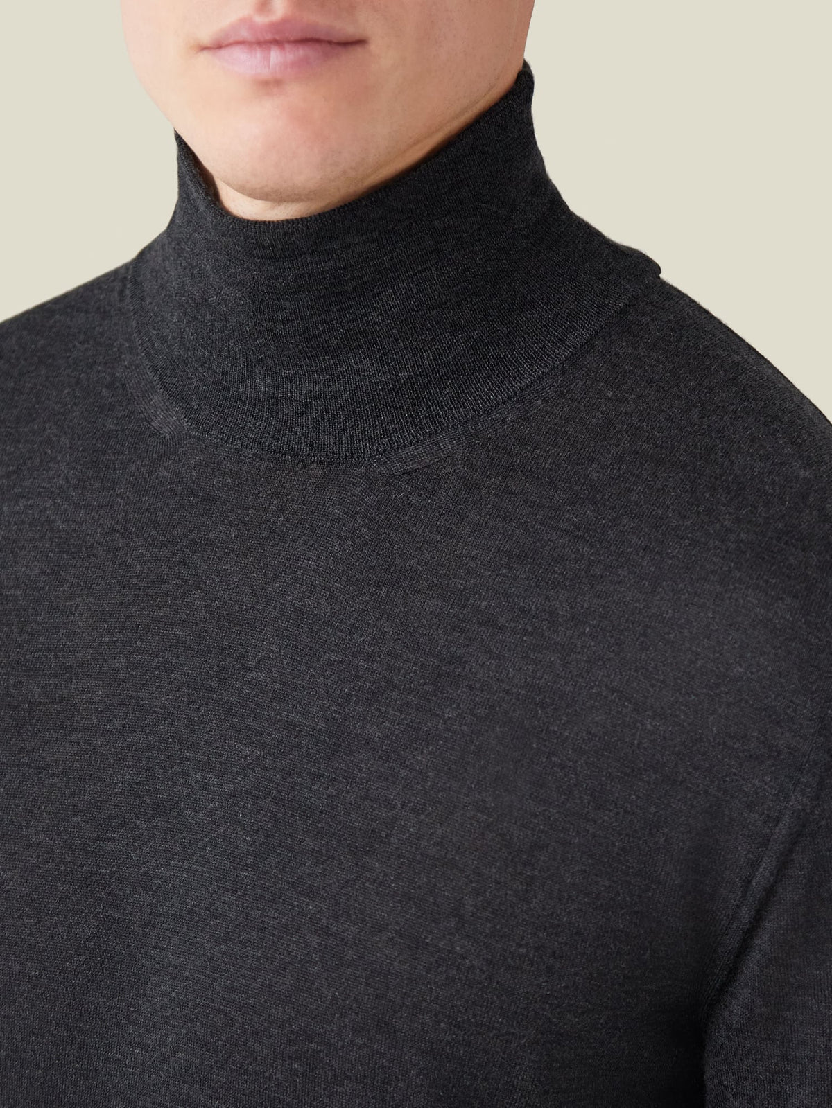 A close-up of the Luca Faloni Silk-Cashmere Mock Neck in Charcoal Grey, showcasing the ribbed collar and fine knit texture.