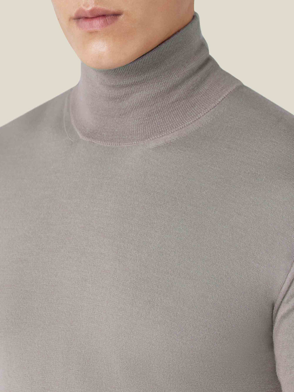 A close-up of the Silk-Cashmere Mock Neck in Nocciola Brown, highlighting the ribbed texture of the collar and the fine knit.