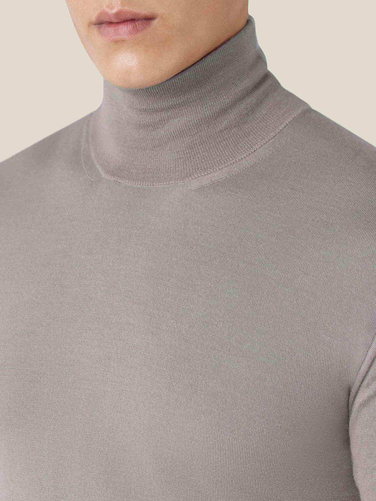 A close-up of the Silk-Cashmere Mock Neck in Nocciola Brown, highlighting the ribbed texture of the collar and the fine knit.