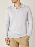 Front view of a model wearing the Luca Faloni Fine Silk Cashmere Polo in Ice Grey, paired with beige chinos.
