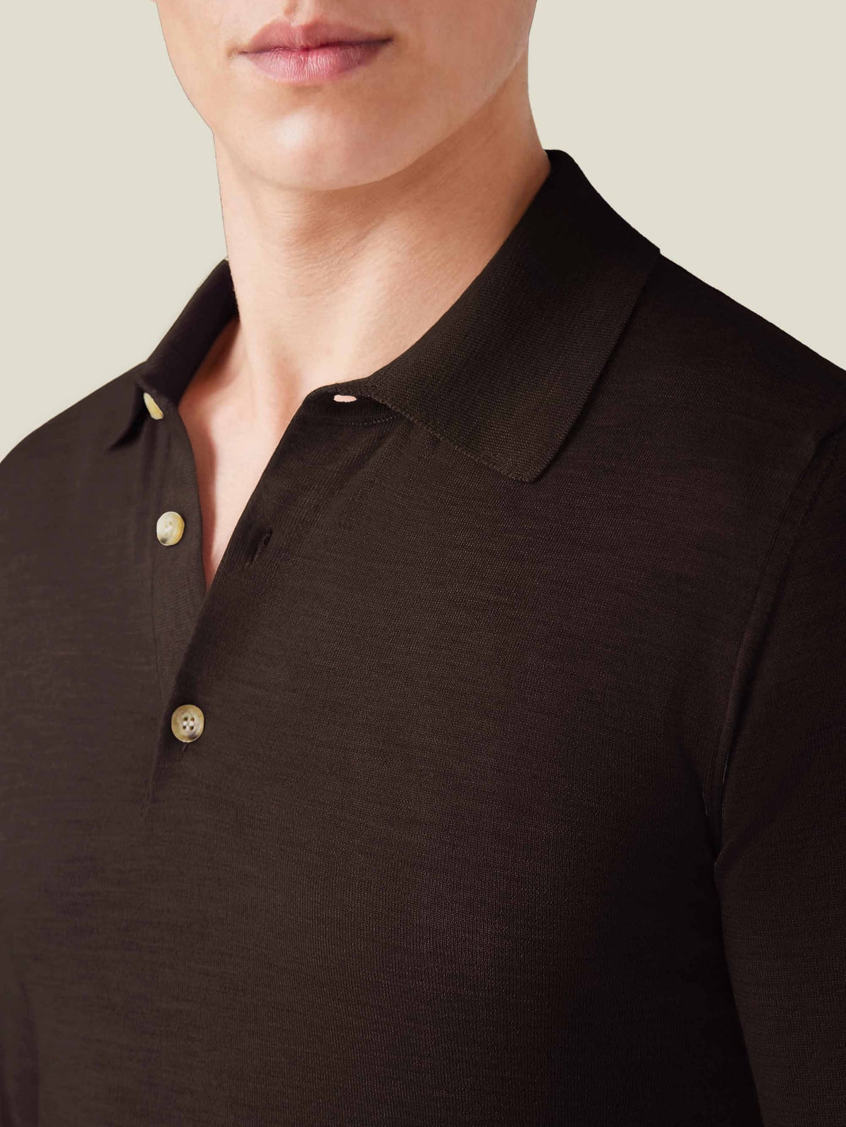 A detailed view of the Luca Faloni Fine Silk Cashmere Polo in Chocolate Brown, showcasing its fine knit, collar, and buttons.