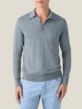 A front view of a model wearing the Luca Faloni Fine Silk Cashmere Polo in French Blue, paired with light wash jeans.