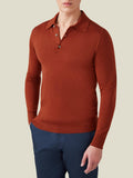 Front view of a model wearing the Luca Faloni Fine Silk Cashmere Polo in Rust, paired with navy trousers.