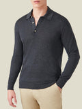 Front view of a model wearing the long-sleeved Fine Silk Cashmere Polo in Charcoal Grey with beige trousers.