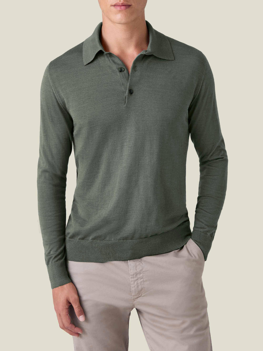 Front view of a model wearing Luca Faloni's Fine Silk Cashmere Polo in Moss Green against a plain background.