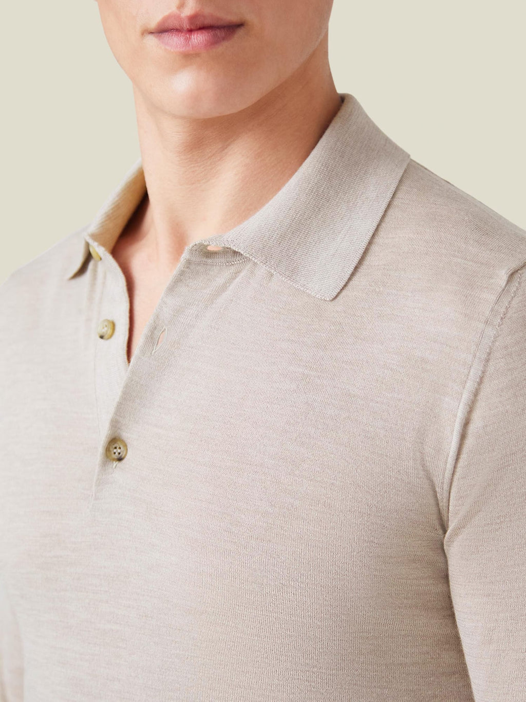 A close-up view of the collar and buttons on the men's Fine Silk Cashmere Polo in Oatmeal.
