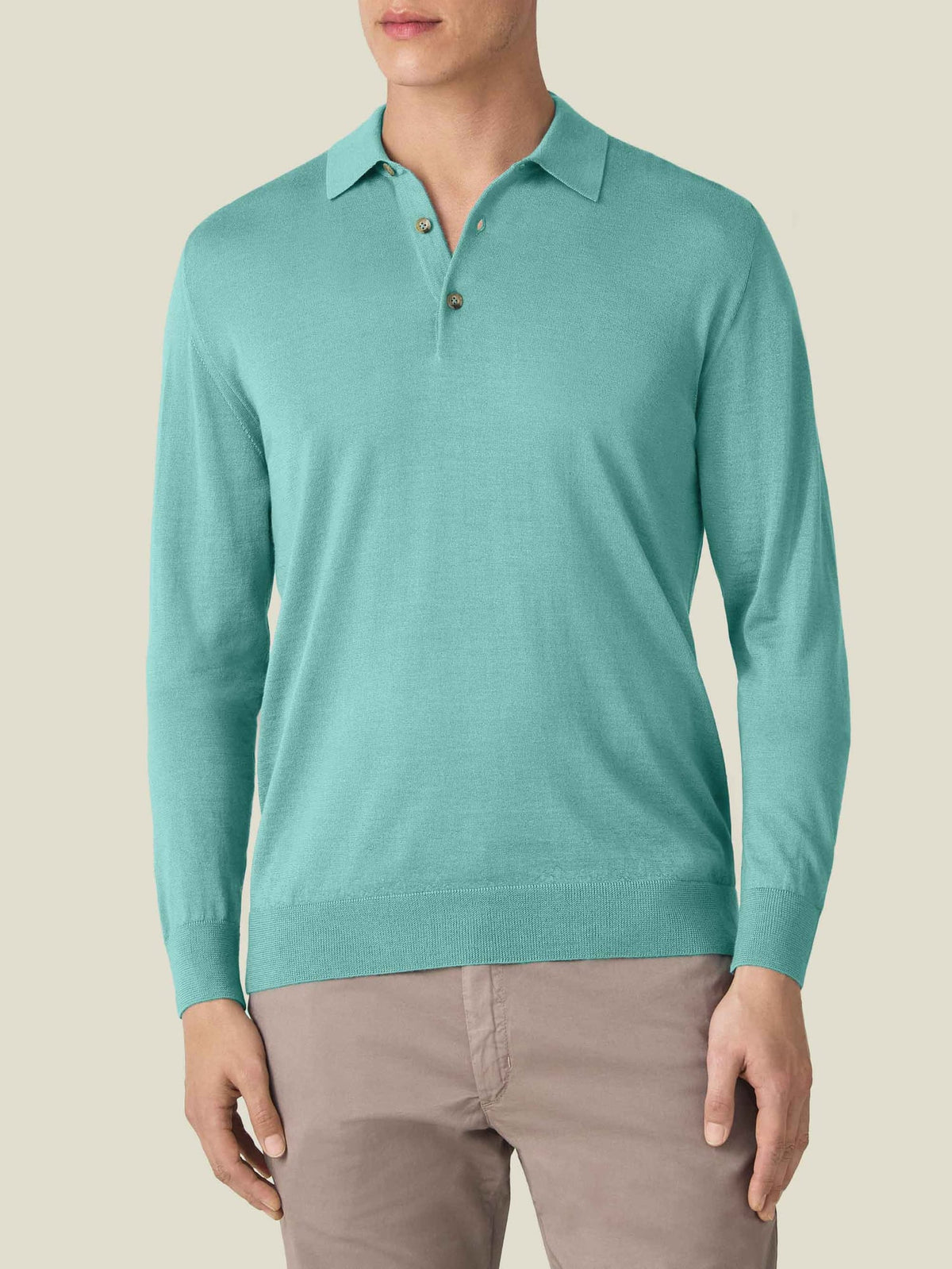 Front view of a model wearing the Luca Faloni Fine Silk Cashmere Polo in aquamarine.