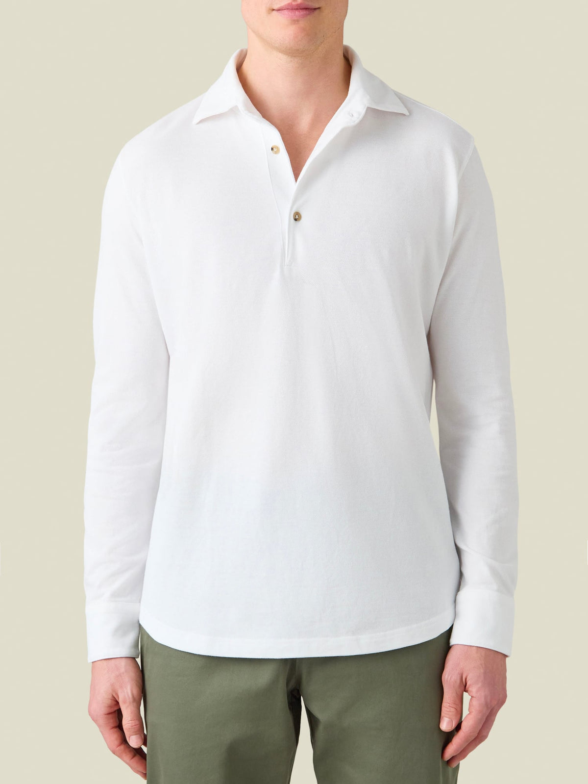 Front view of a model wearing the Brera Piqué Polo Shirt in white.