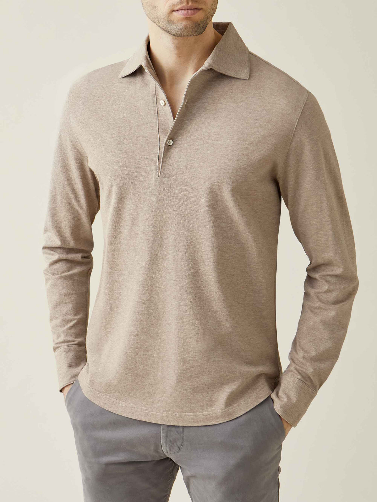 Front view of a model wearing the long-sleeved Brera Piqué Polo Shirt in Oatmeal.