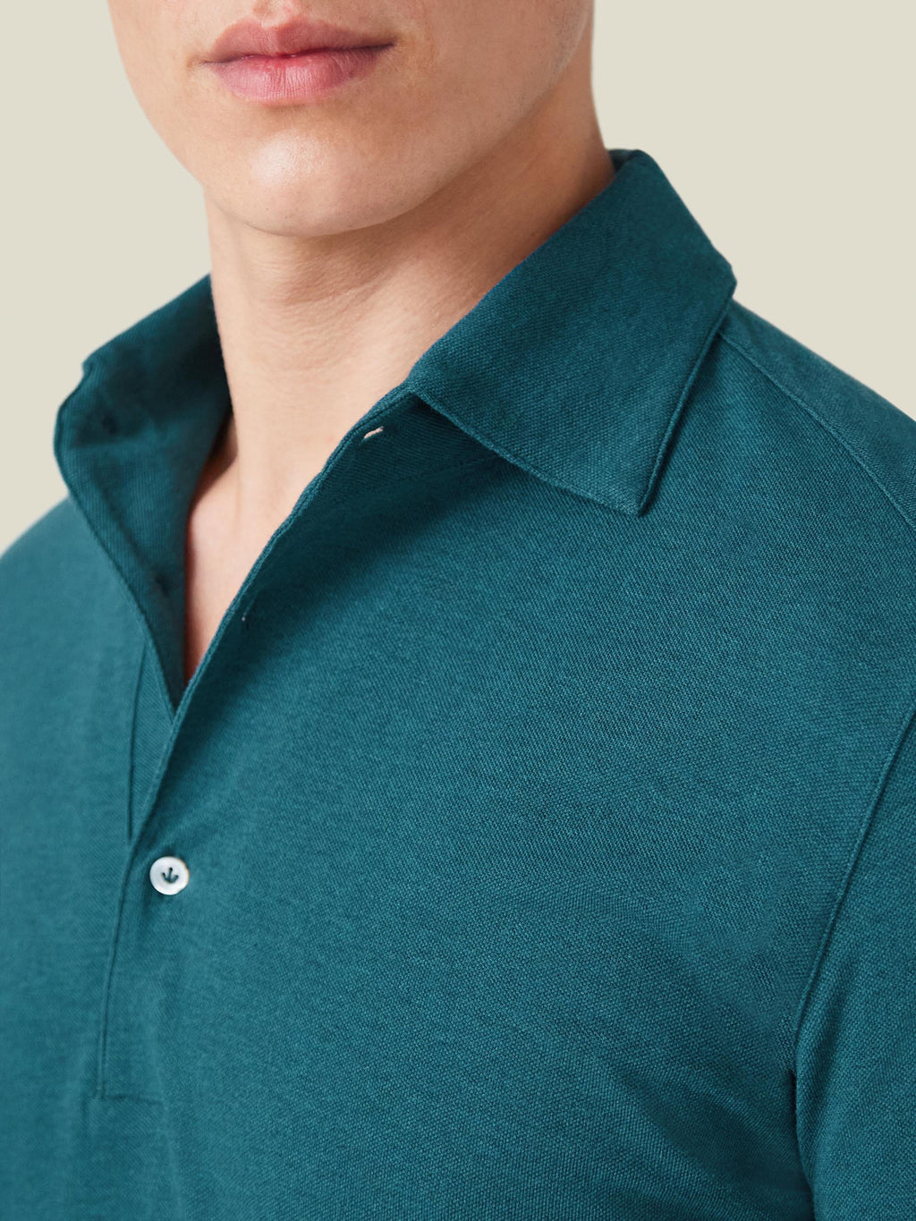 Detailed view of the Forest Green Brera Piqué Polo Shirt, showing the cotton piqué fabric and one-piece collar.