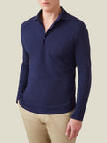 Front view of a model wearing the long-sleeved Brera Piqué Polo Shirt in navy blue.