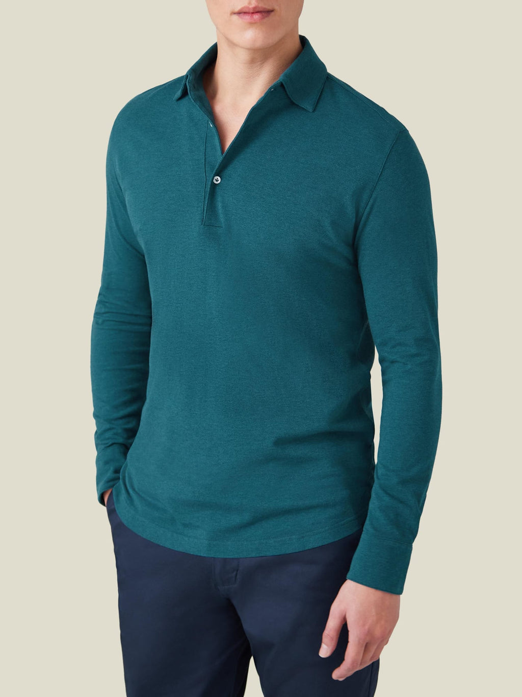 A model seen from the front, wearing the Luca Faloni Brera Piqué Polo Shirt in Forest Green.