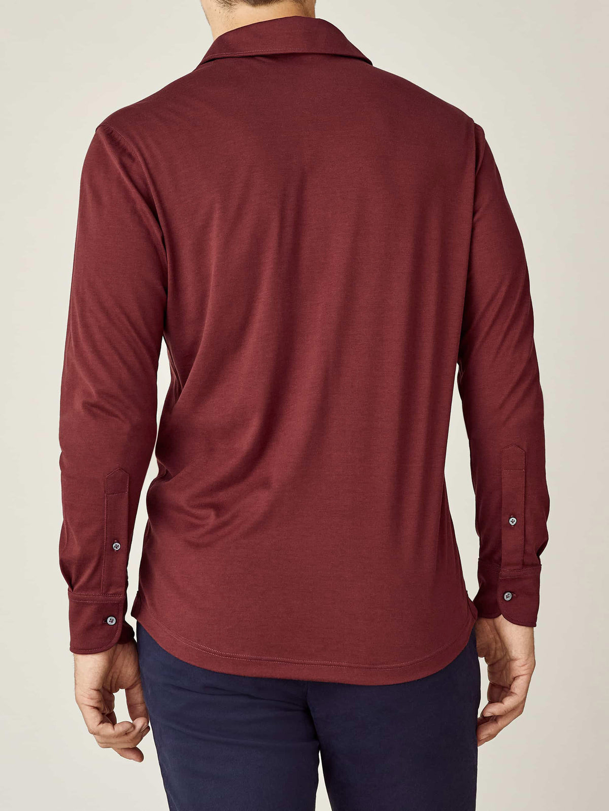 Back view of a man wearing the Amalfi Silk-Cotton Polo Shirt in Lava Red.