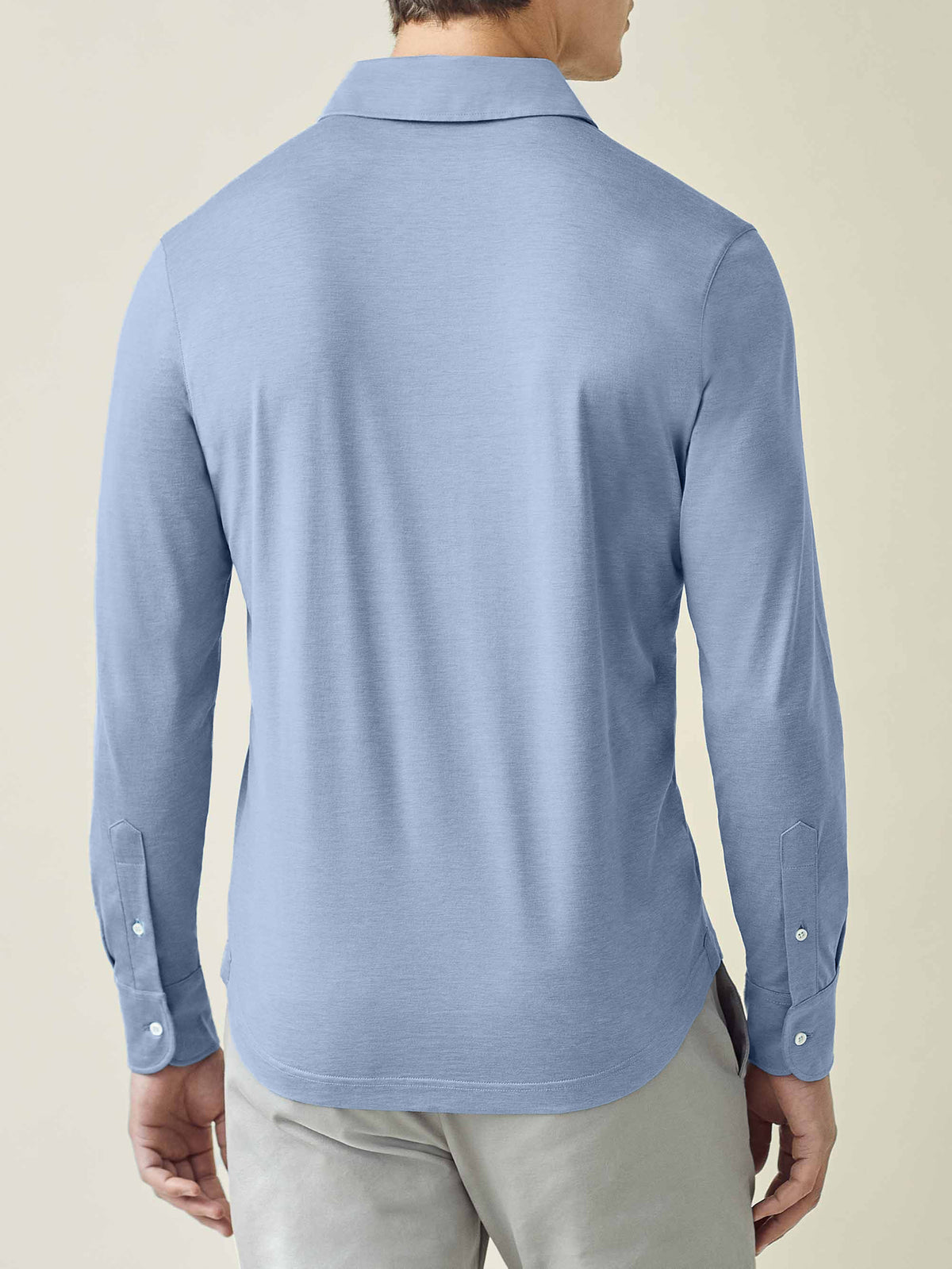 Back view of the Luca Faloni Amalfi Silk-Cotton Polo Shirt in light blue on a model.